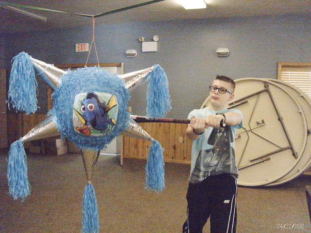 PETER TAKING A WACK AT THE PINATA